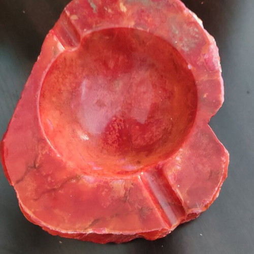 Large ashtray used red with veins