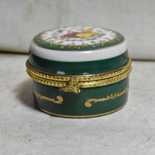 Miniature porcelain jewelry box used with romantic design