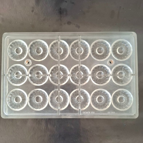 Polycarbonate chocolate mold used, 18 cavities, flower design
