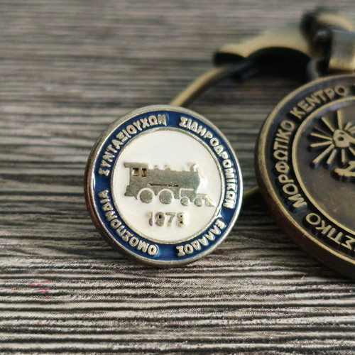 Railway retirees pin and Athens 2004 Olympic keychain set