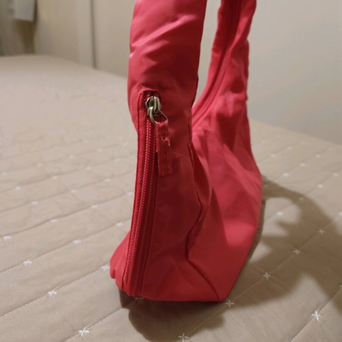 Nylon handbag like new, pink fluo with 3 compartments