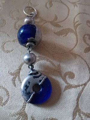 Keychain used with blue glass beads and metal elements