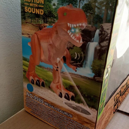 Dinosaur toy like new, in original box with minor wear