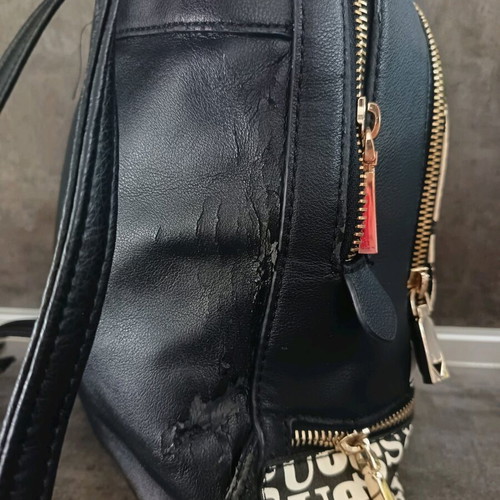 Guess backpack used with leather cracks