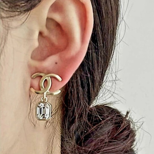 Chanel earrings with white and gold details