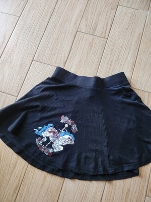 Cotton short skirt with carousel horse print, like new, black, size M