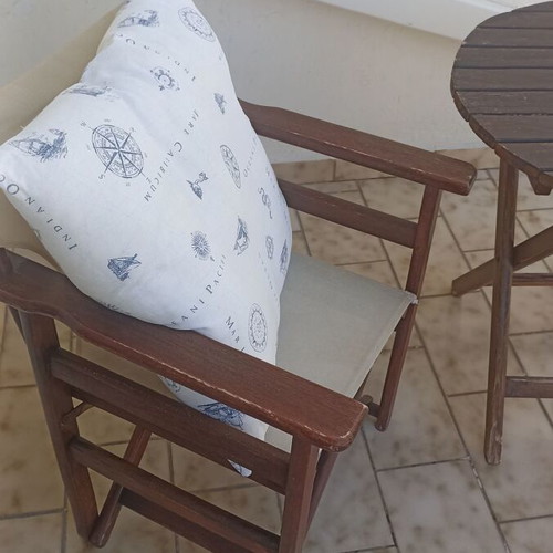 Wooden balcony set with table and two chairs used