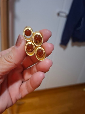 Vintage pin with circular details in gold and brown, used