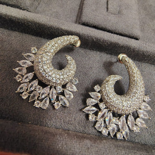 Earrings like new with zircon stones, silver color