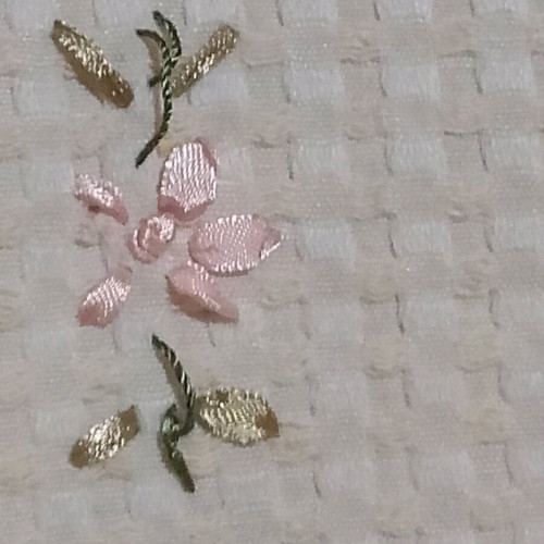 Embroidered tablecloth like new with satin ribbon and floral motifs