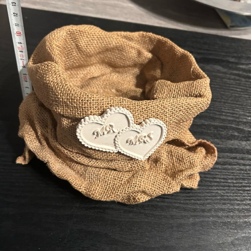 Hard pouch made of burlap with ceramic decoration like new