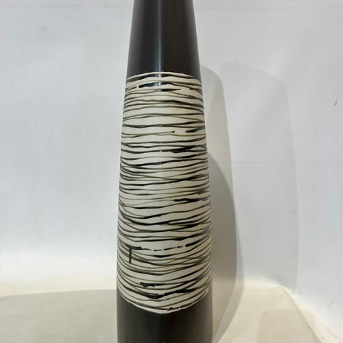 Modern ceramic conical vase with black and white striped design used