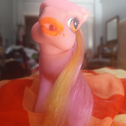 Large pink pony toy with colorful mane and tail