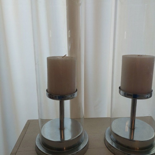 Set of 2 used candlesticks with silver frame and transparent glass