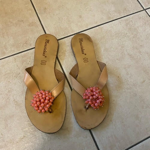 Leather sandals used with orange glass bead flower