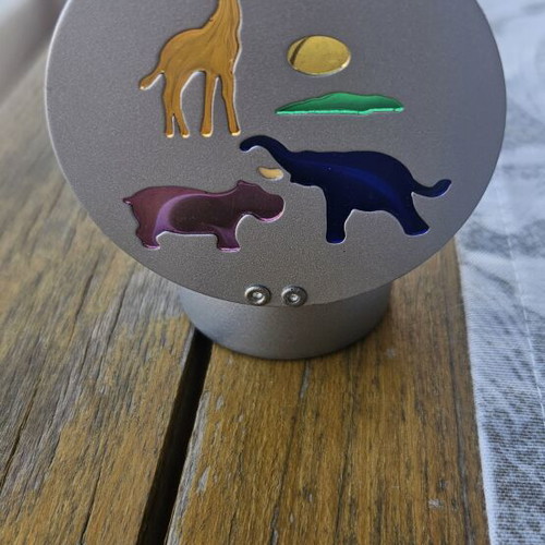 Metal tealight holder with stained glass animals
