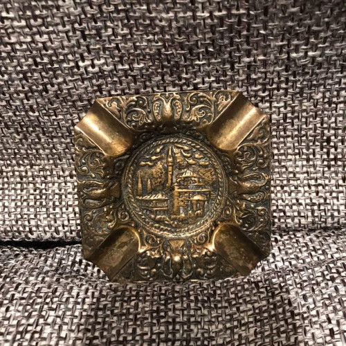 Bronze carved ashtray like new with embossed decorative motifs