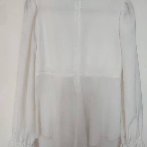 Stefania Vaidani white blouse with deep V neckline