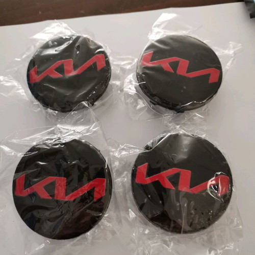 Kia 58mm wheel center caps new, black with red letters