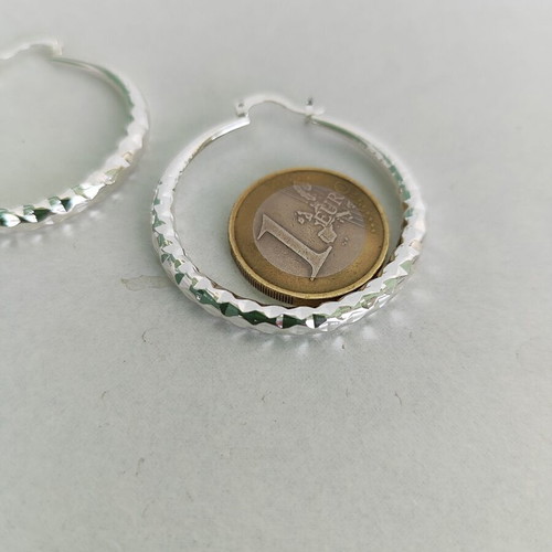 Silver-tone hoop earrings like new with diamond-cut texture