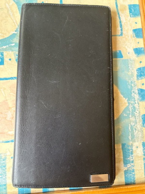 Large leather wallet used with multiple compartments, black