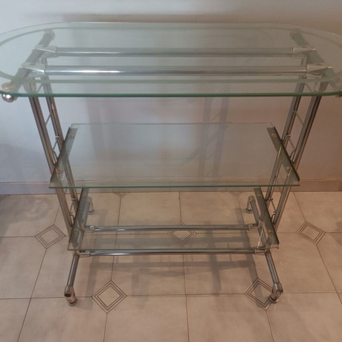 Glass professional shelving unit used with sandblasted glass and nickel frame