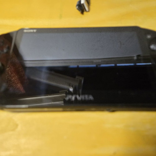Sony PS Vita Slim console with 8GB card and games