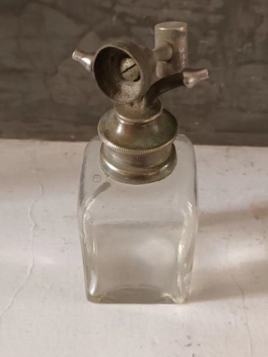 Vintage perfume bottle crystal clear with metal spray used