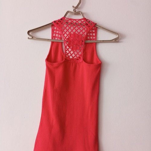 Red sleeveless blouse like new with white shorts and striped belt