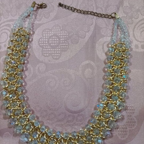 Women's evening necklace like new with gold weave and white stones