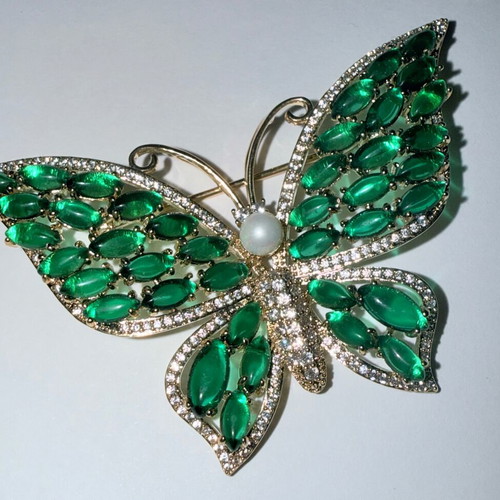 Vintage butterfly brooch with green cabochon stones and white zircon, like new
