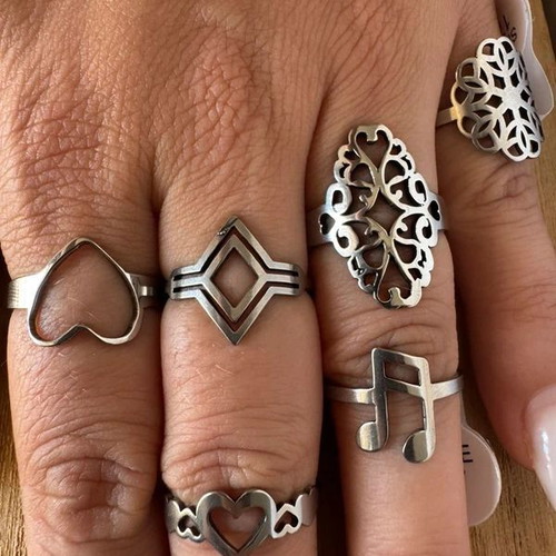 Steel ring set with hearts, geometric and floral designs