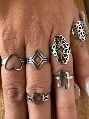Steel ring set with hearts, geometric and floral designs