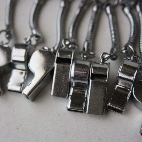 Card with 12 old metal whistle keychains from 1980s new