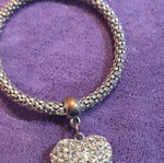 Elastic bracelet used with decorative silver heart charm