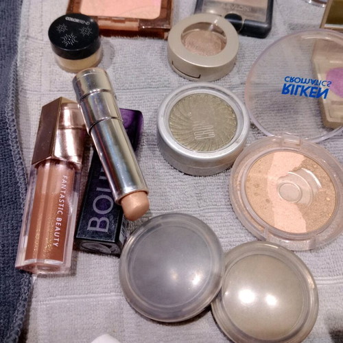 Cosmetics set used with eyeshadows, blushes, lipstick, and lip gloss