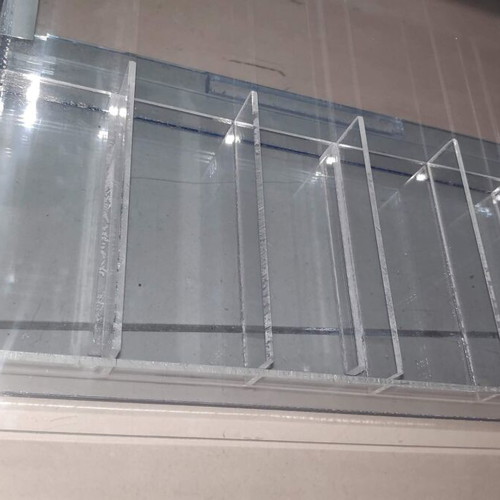 Tabletop plexiglass product display stand like new with metal decorations
