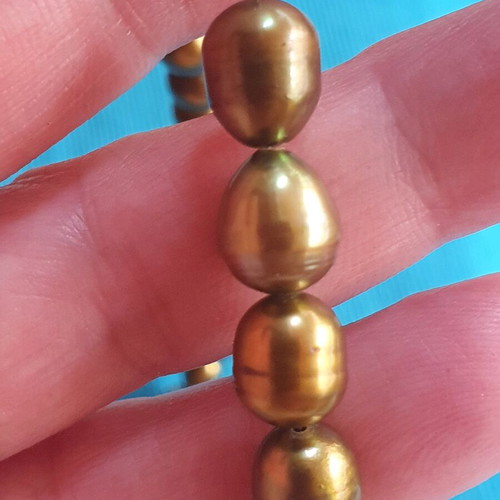Necklace with natural pearls like new, khaki color, silver clasp