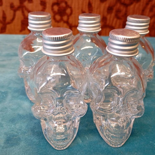 Decorative skulls and miniature bottles unused, set of 6+5 with large jar
