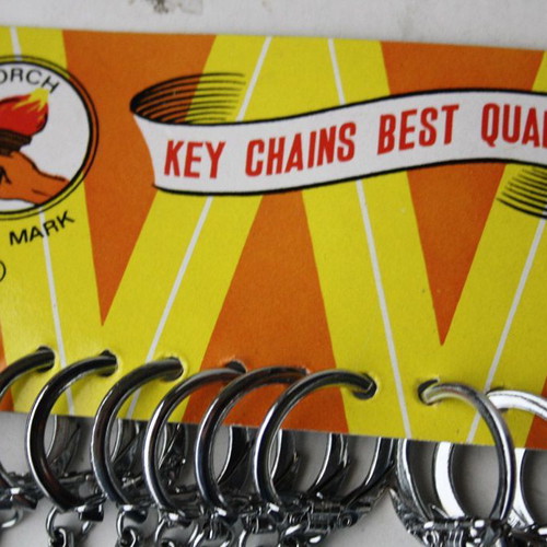 Card with 12 old metal whistle keychains from 1980s new