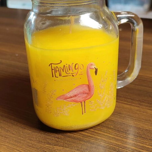 Vanilla scented candle in Flamingo glass jar like new