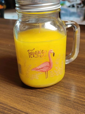Vanilla scented candle in Flamingo glass jar like new