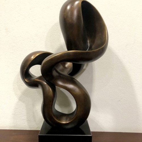 Modern sculpture used on black base, height 62cm