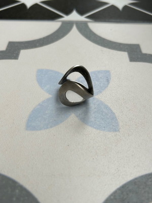 Metal ring used with geometric abstract design and matte finish
