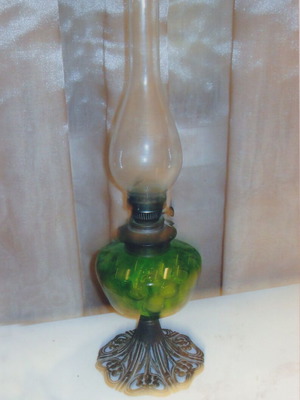 Vintage oil lamp like new with antimony base and green glass