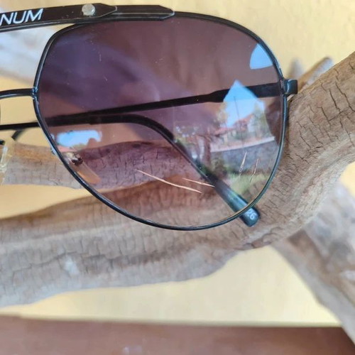 Vintage 90s Magnum sunglasses, one broken lens