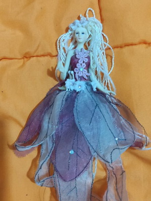 Porcelain doll used, small hanging size with tulle skirt