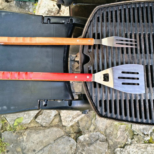 Barbecue set used with stainless steel fork and spatula with wooden handles