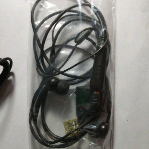 Sony Ericsson W715i mobile phone used, functional, with charger and headphones