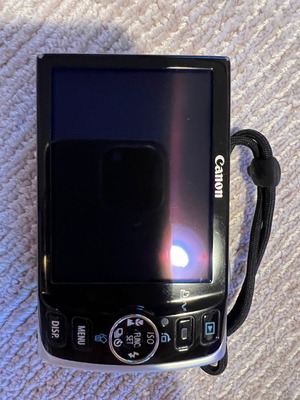 Canon digital camera used with case and charger